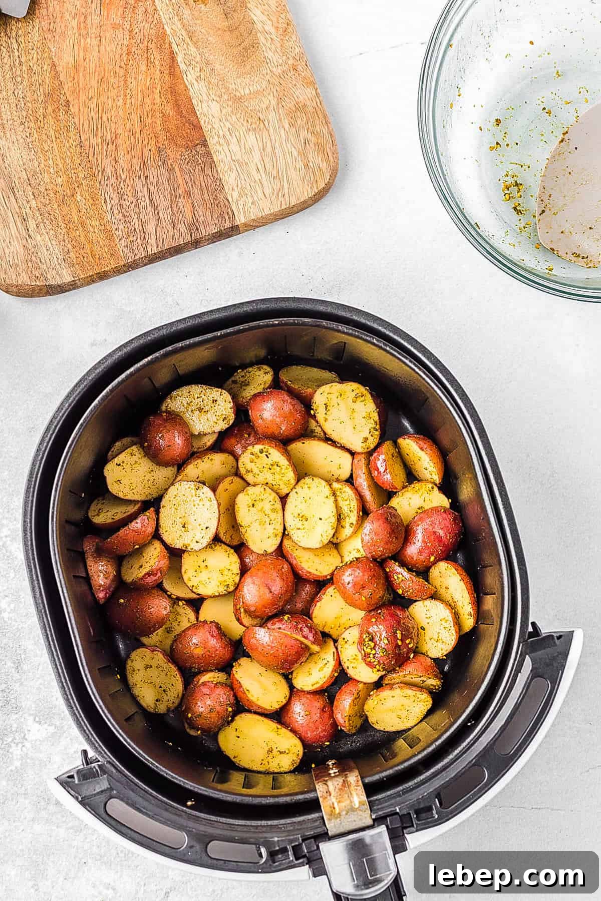 Crispy Air-Fryer Red Potatoes Recipe for Perfectly Roasted Sides 6 Raw potatoes in the air fryer basket.