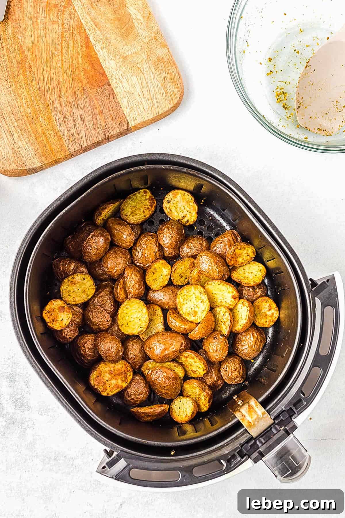 Crispy Air-Fryer Red Potatoes Recipe for Perfectly Roasted Sides 7 Cooked red potatoes in air fryer basket.