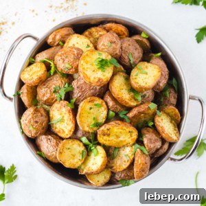 Crispy Air-Fryer Red Potatoes Recipe for Perfectly Roasted Sides 9 roasted red potatoes in a bowl sprinkled with parsley