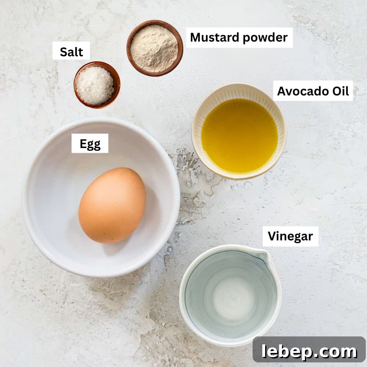 Creamy Immersion Blender Mayonnaise Recipe in Minutes 3 Ingredients in different bowls including an egg, oil, salt, vinegar and mustard powder.