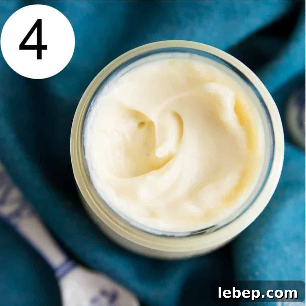 Creamy Immersion Blender Mayonnaise Recipe in Minutes 7 A glass jar with mayonnaise in it.