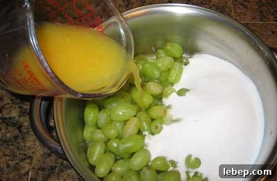 Greek Grape Spoon Sweet (Stafili Glyko) — Traditional Recipe 2 Mixing grapes and other ingredients for Greek spoon sweet stafyli gliko.