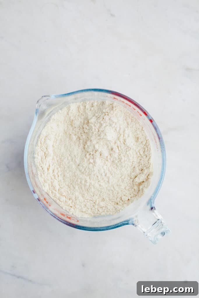 Decadent Tiramisu Layer Cake Recipe for Coffee Lovers 5 A large glass jug with flour in it