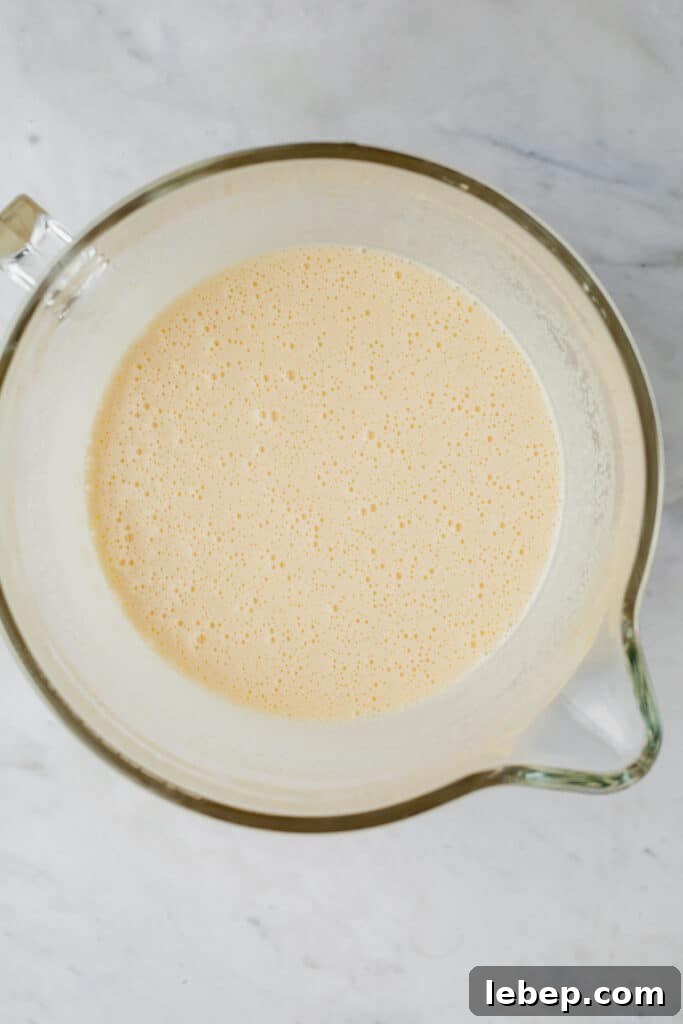 Decadent Tiramisu Layer Cake Recipe for Coffee Lovers 6 An overhead shot of a glass bowl with cake batter