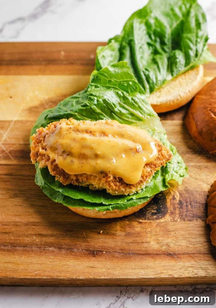 Crispy Fried Chicken Sandwich Recipe with Tangy Slaw 14 Honey mustard added to the chicken breasts.