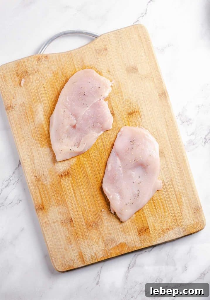 Crispy Fried Chicken Sandwich Recipe with Tangy Slaw 5 Chicken breasts seasoned and flatted.