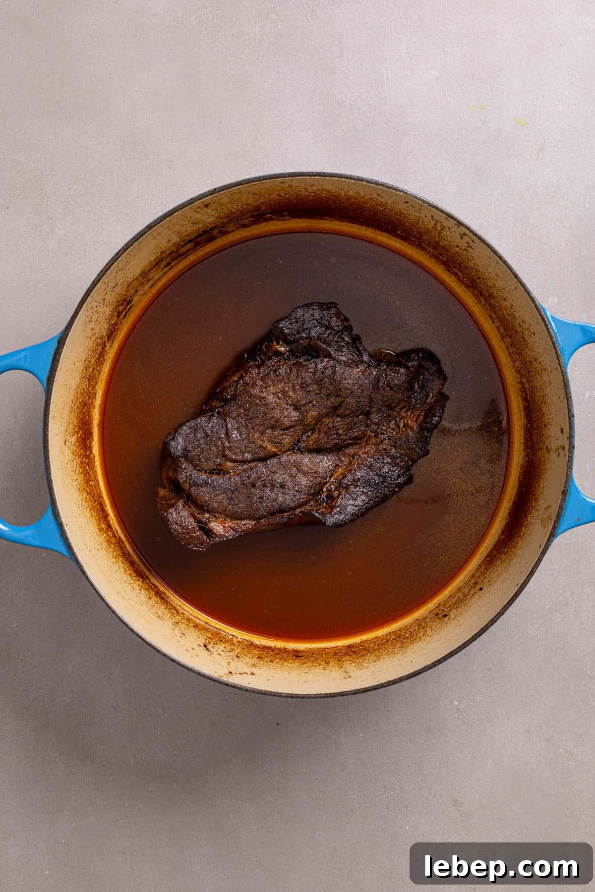 Citrus-Soy Braised Chuck Roast Recipe: Tender, Flavorful Pot Roast 6 A Dutch oven with braised chuck roast whole.