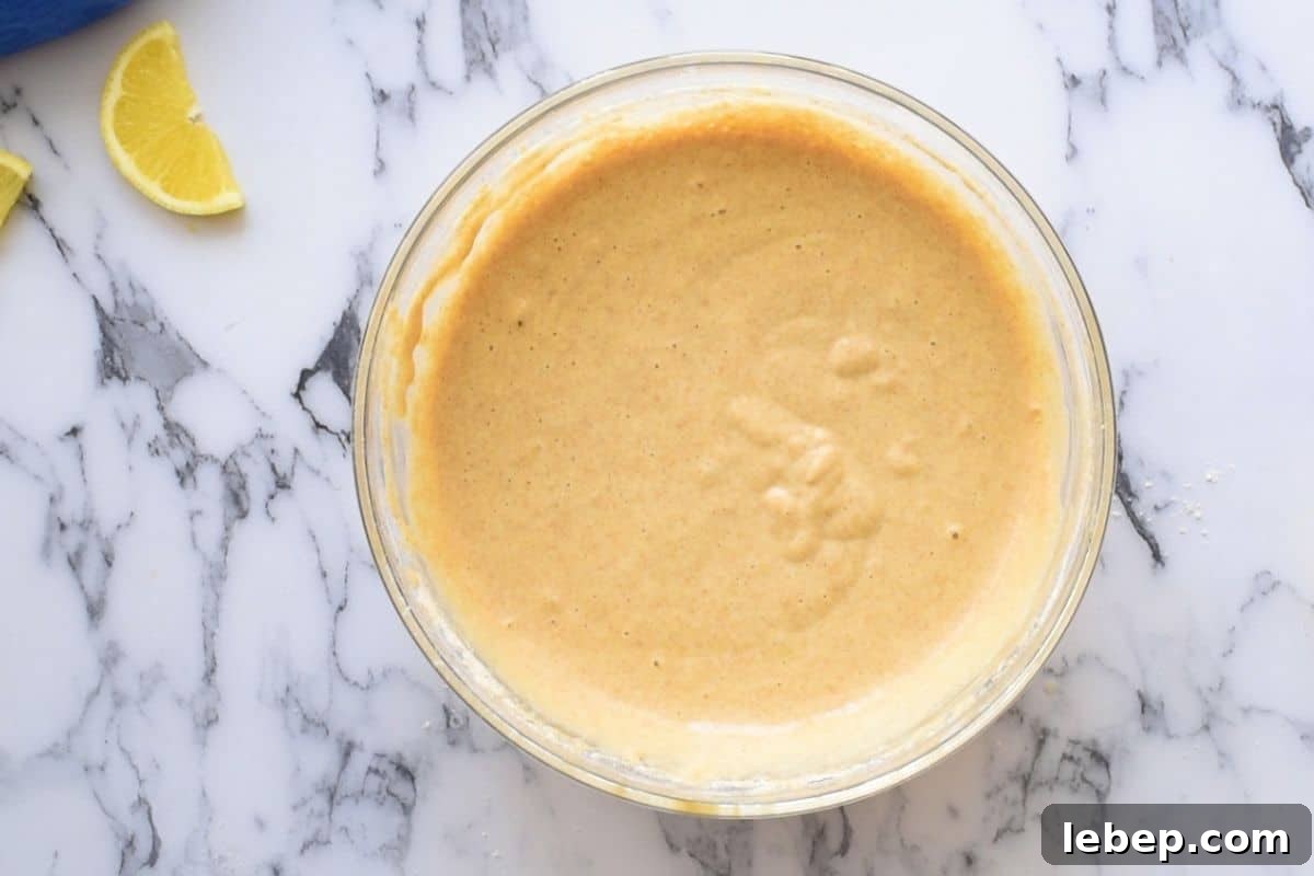 Whole Wheat Pancake Recipe Batter for whole wheat pancake batter in large mixing bowl.