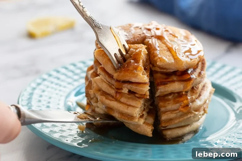 Whole Grain Pancake REcipe Stack of whole wheat Pancakes being cut.