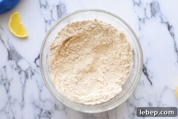 Fluffy Whole Wheat Pancakes with Maple Syrup Recipe 4 Sifted ingredients for whole wheat pancakes in large mixing bowl.