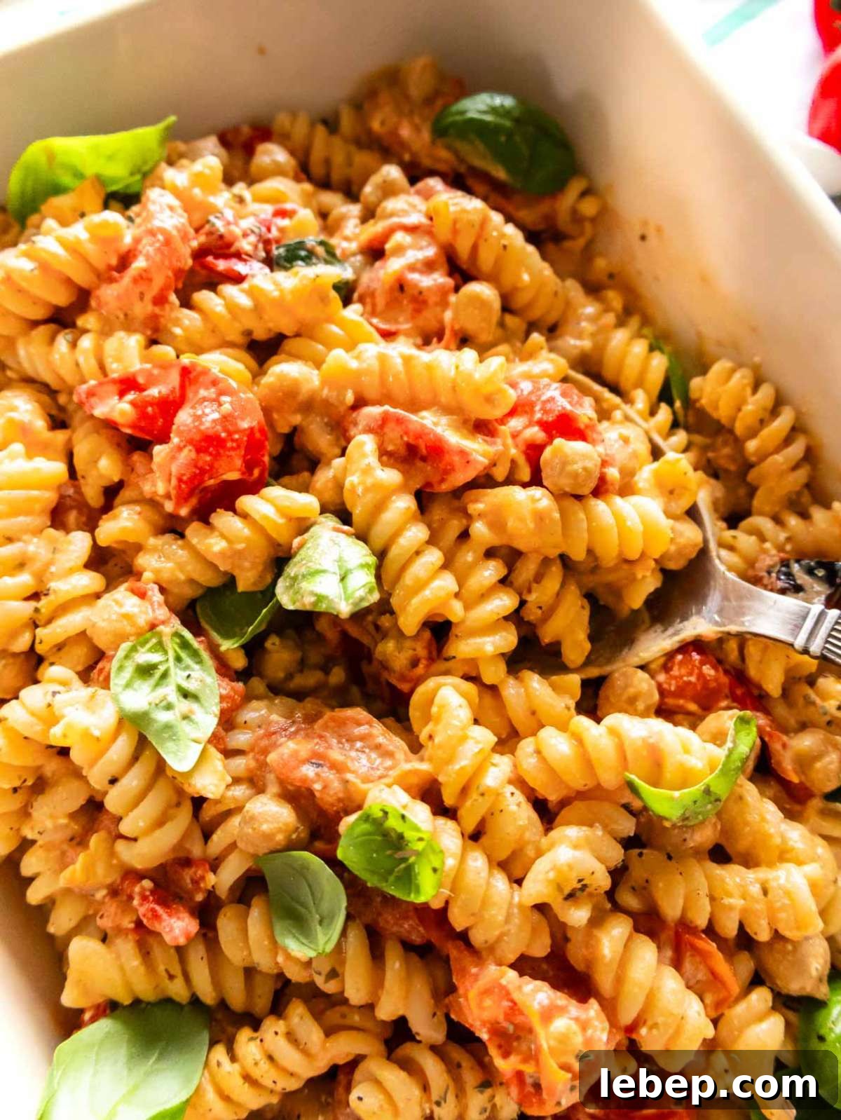 Creamy baked feta pasta with bursting cherry tomatoes and golden chickpeas.