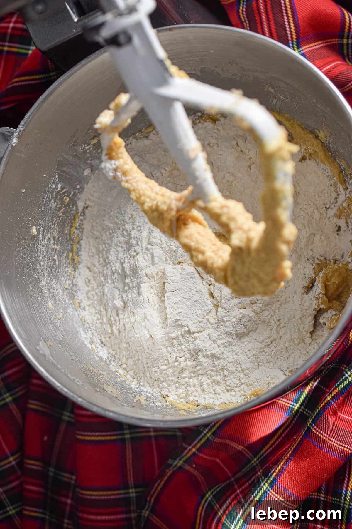 Chewy Coconut Pecan Cookies Recipe — Crispy Edges & Gooey Center 6 The flour mixture is added to the bowl.