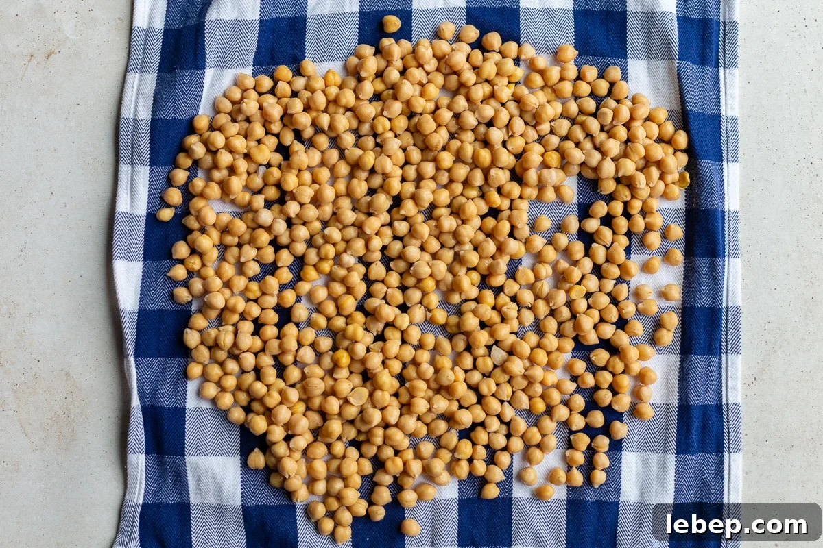 chickpeas on a blue and white towel to be thoroughly dried off