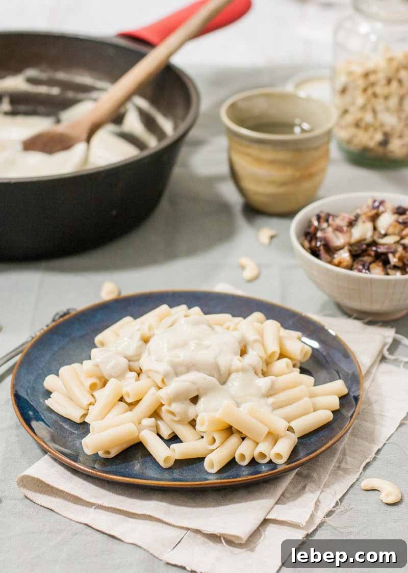 Vegan Gluten-Free Alfredo Pasta with Sautéed Radicchio 6 An oblique view of a rice based gluten-free pasta made with dairy-free vegan Alfredo sauce made with creamed cashews.