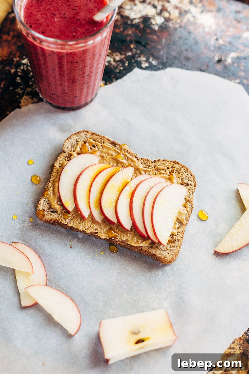 Apple & Honey Peanut Butter Toast Recipe — Quick Morning Snack 4 Peanut Butter Toast with Apples and Honey with a smoothie on the side.