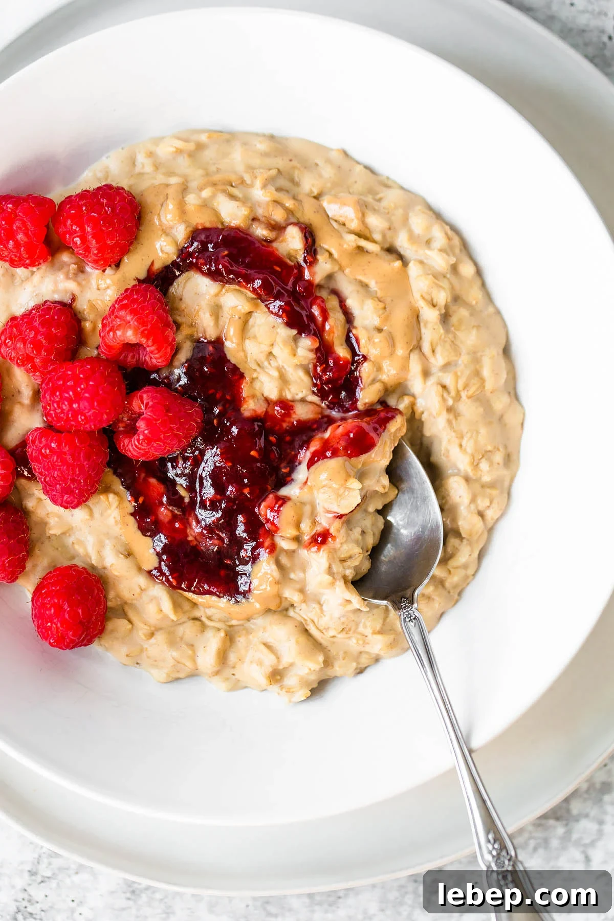 Apple & Honey Peanut Butter Toast Recipe — Quick Morning Snack 7 peanut butter and jelly oatmeal with raspberries on top