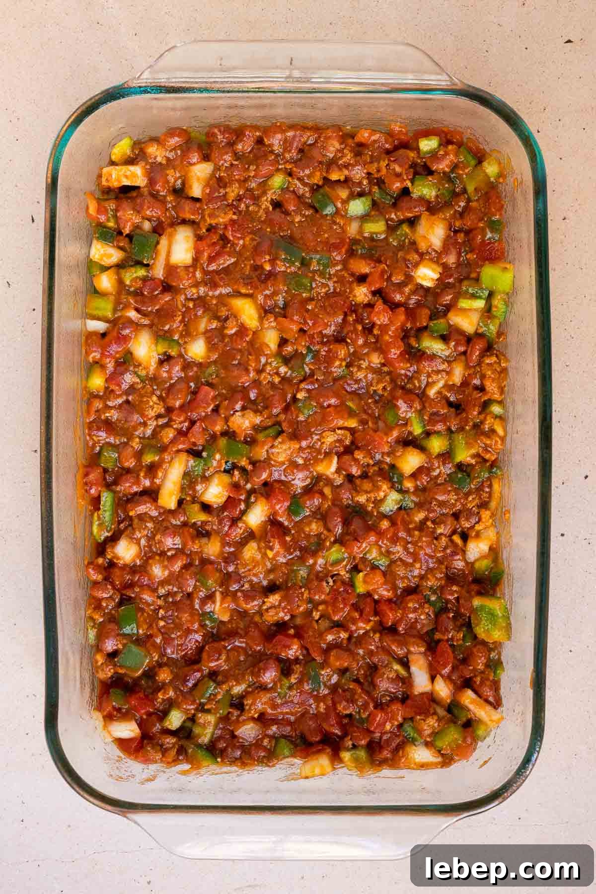 Canned Chili Cornbread Casserole Recipe for Quick Weeknight Dinner 6 The canned chili and diced veggies are mixed together.