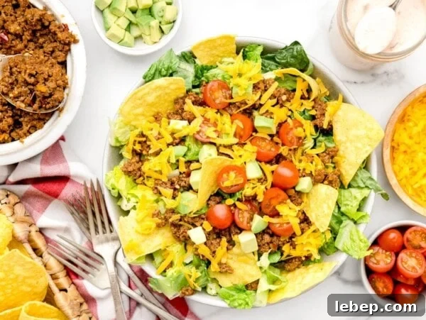 Walking Tacos: Portable Taco Cups for Parties and Snacks 6 A bowl of taco salad recipe with a homemade dressing.