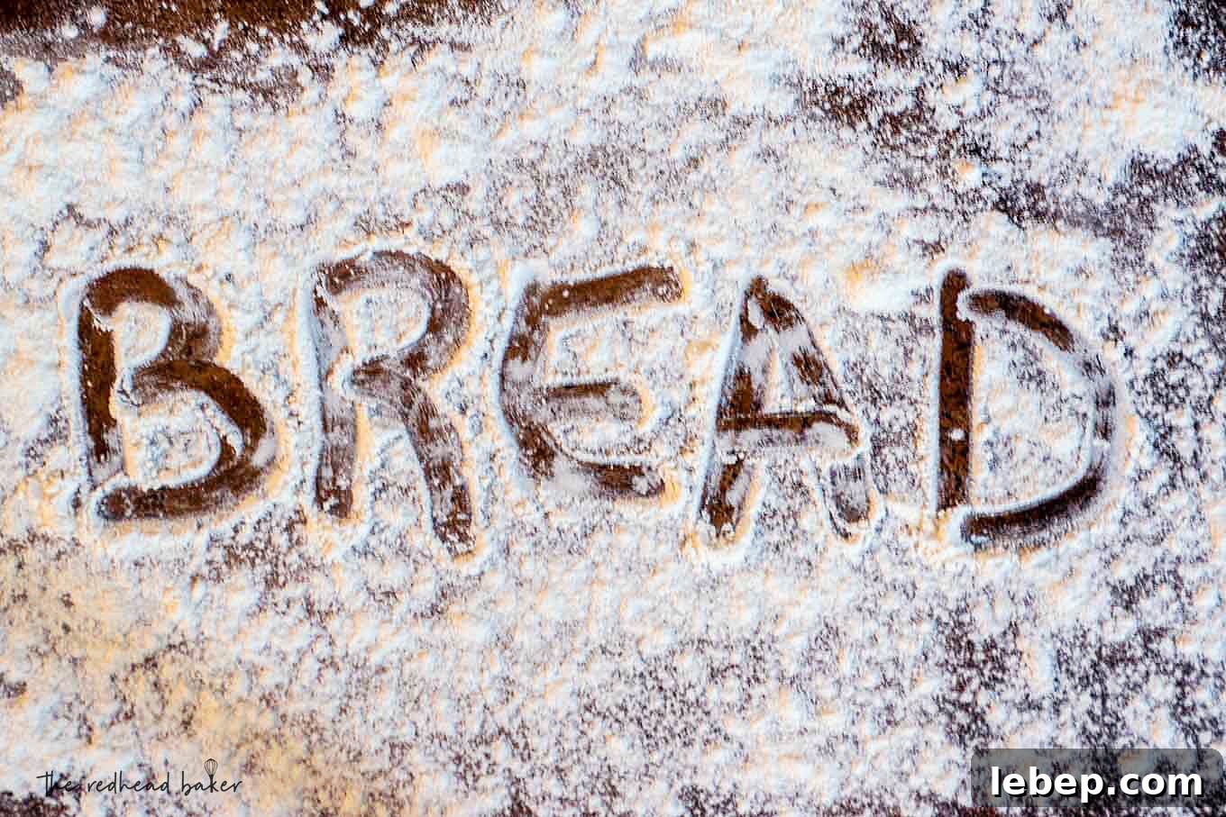 How to Bake Bread at Home: Classic Italian Bread Recipe 2 The word "bread" written in flour on a sheet pan.
