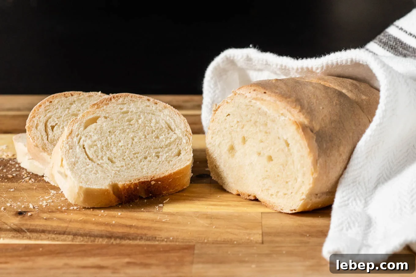 How to Bake Bread at Home: Classic Italian Bread Recipe 5 A loaf of Italian bread with the end cut off.