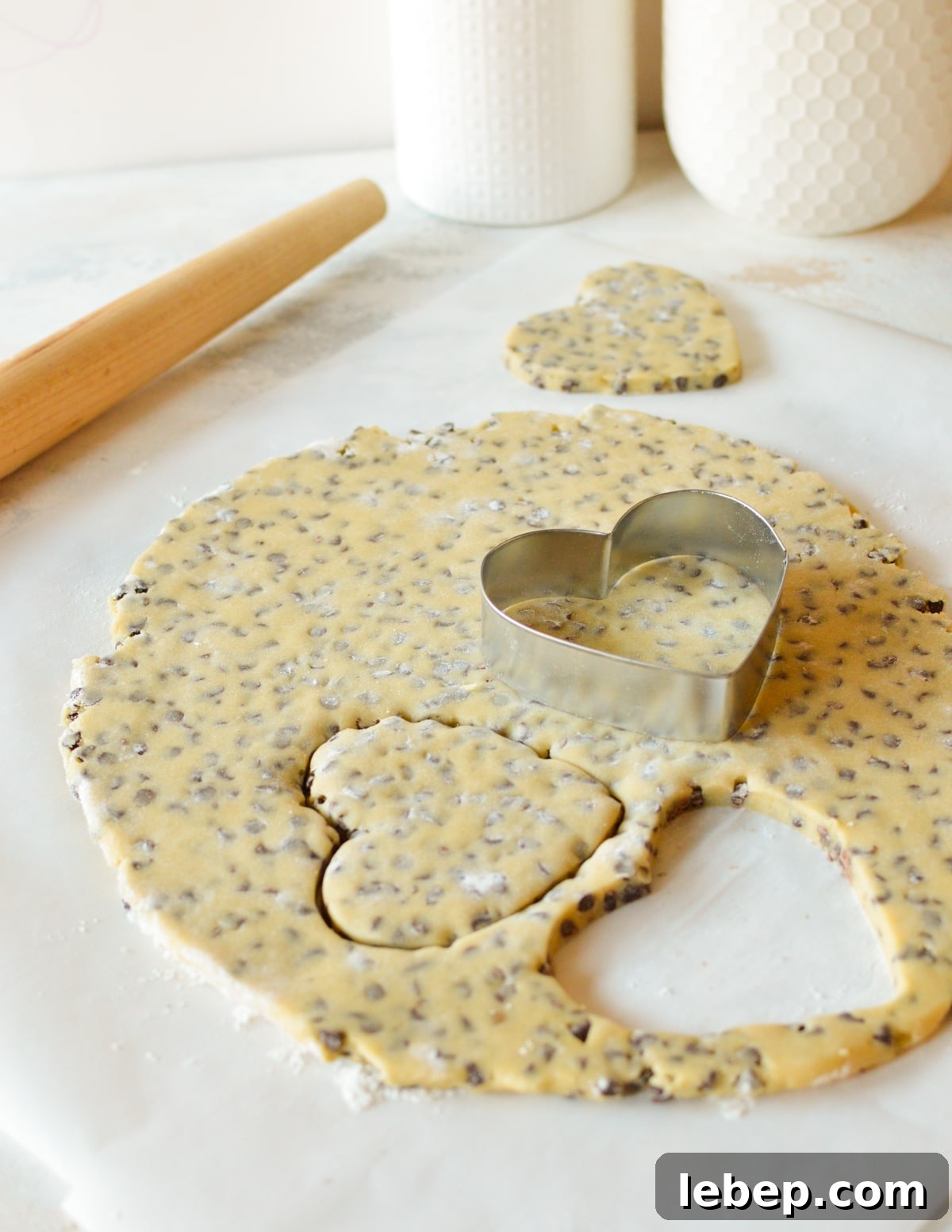 Heart-Shaped Chocolate Chip Cookies Recipe for Valentine Treats 7 cookie dough rolled thin with hearts cut out of it