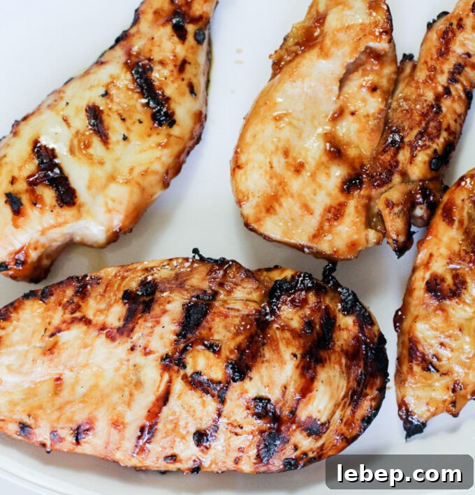 General Tso Grilled Chicken Rice Bowls — Sweet-Spicy Asian Flavor 5 grilled chicken breast on a plate.