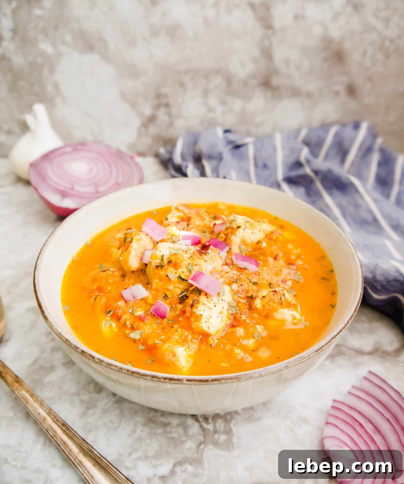 Cherry tomato sauce with chicken in it in a bowl.