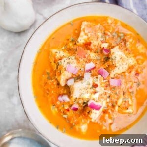 Cherry Tomato Sauce with Chicken in a bowl with onions on top.