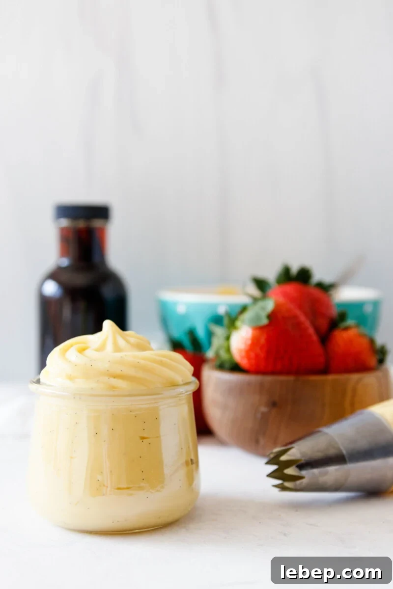 Classic Pastry Cream (Crème Pâtissière) Recipe for Desserts 2 pastry cream piped into a small jar and up into a small point to show consistency