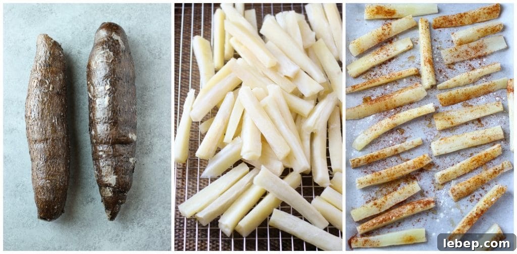 Two whole pieces of yuca root, sliced in strips and seasoned in a sheet pan lined with parchment paper