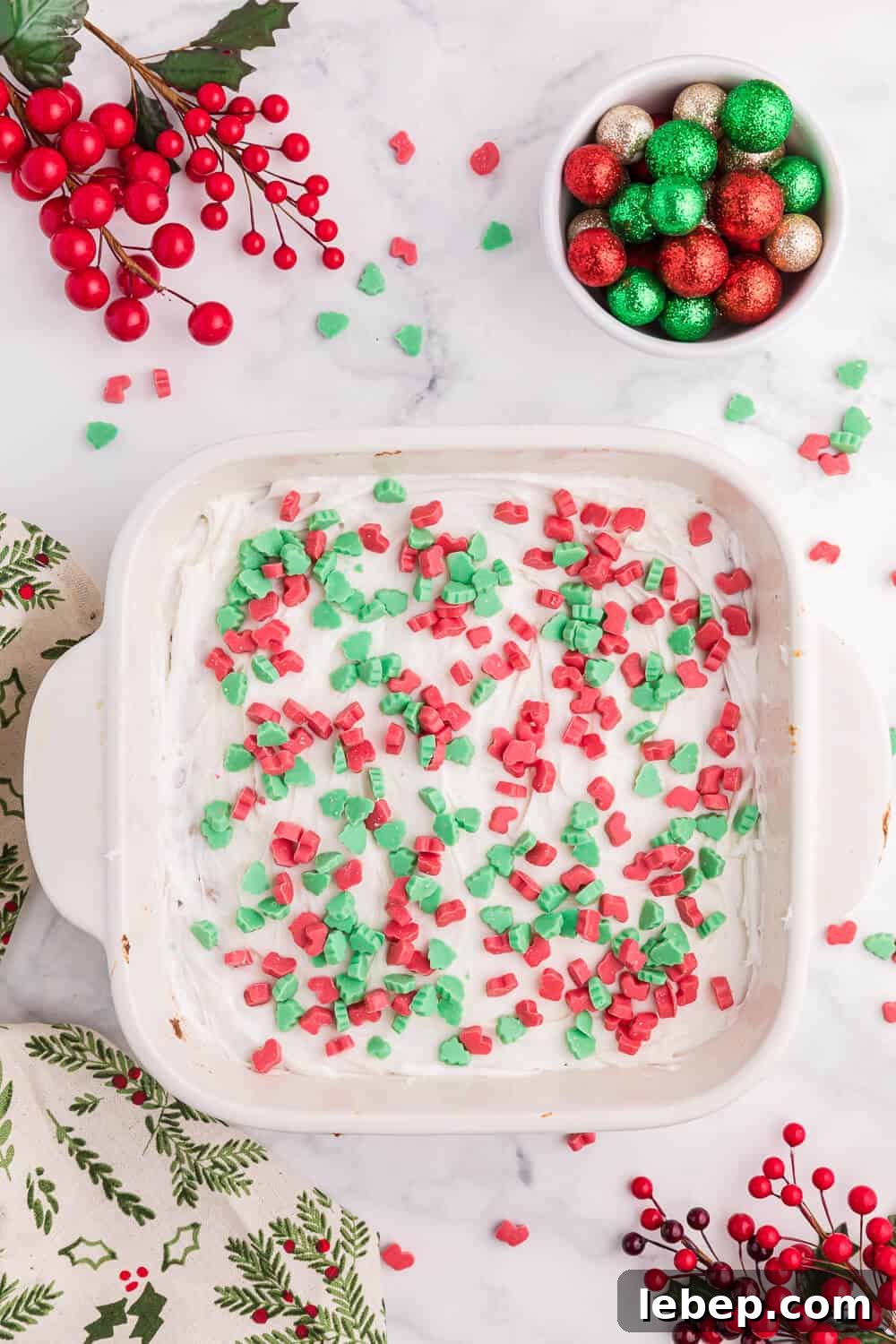 Christmas chewy bars in a white baking pan.