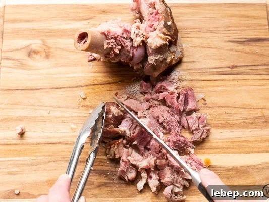Stovetop Ham and Bean Soup Recipe — Ready in Minutes 6 Chopping up ham from ham bone
