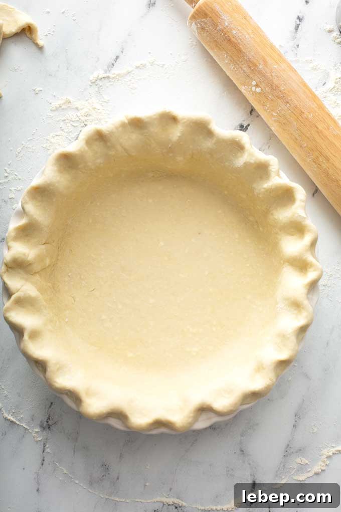 Unbaked pie crust on a pie plate