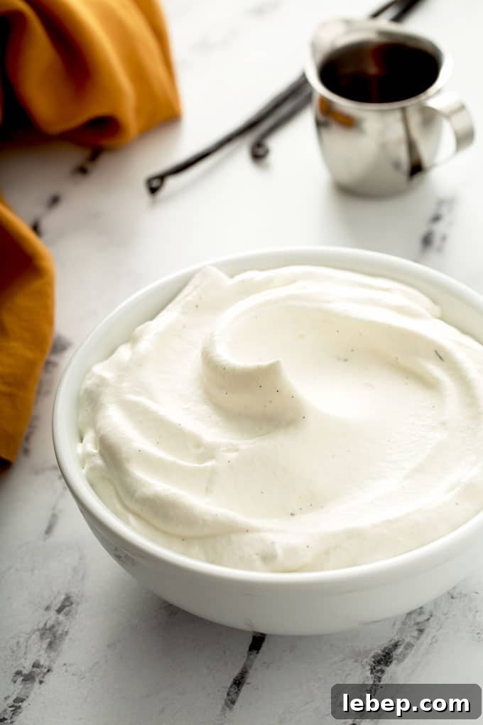 Light and fluffy maple whipped cream in a white bowl.