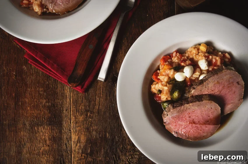 Tender Melt-in-Your-Mouth Eye of Round Roast Recipe 2 Dish of fall risotto and two slices of perfectly cooked eye of round roast