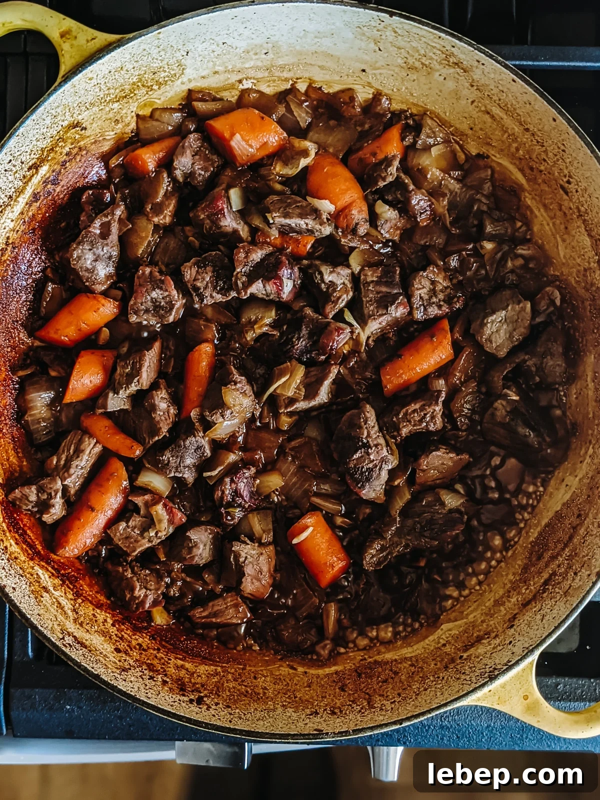 Tender Melt-in-Your-Mouth Eye of Round Roast Recipe 7 Stew meat and veggies in the pot ready to make the au jus.