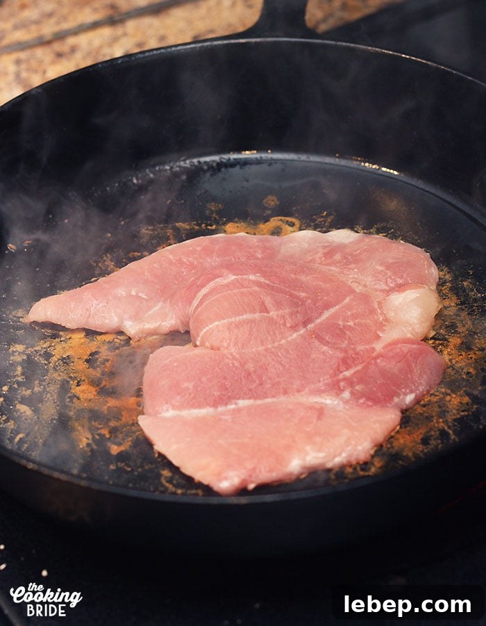 Southern Country Ham with Classic Red-Eye Gravy Recipe 5 cooking the country ham in a cast iron skillet