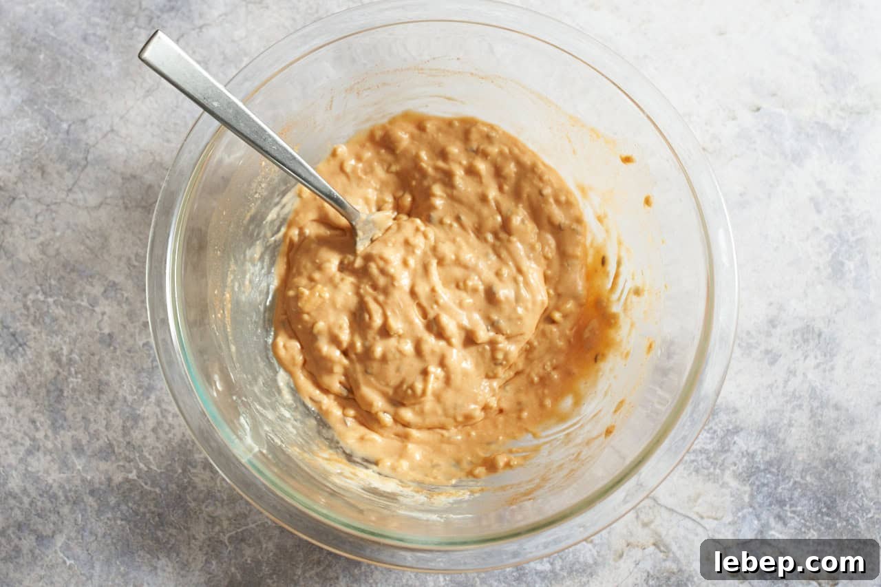 Obatzda cheese spread fully mixed together in a bowl with a fork.