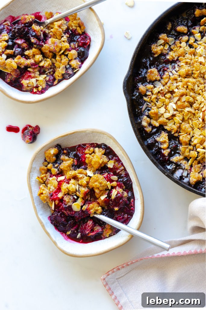Mixed Berry Oat and Almond Crisp Recipe 19 Scooping up Mixed Berry Oat Almond Crisp