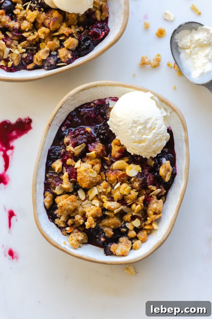Mixed Berry Oat and Almond Crisp Recipe 22 Mixed Berry Oat Almond Crisp with a scoop of vanilla ice cream