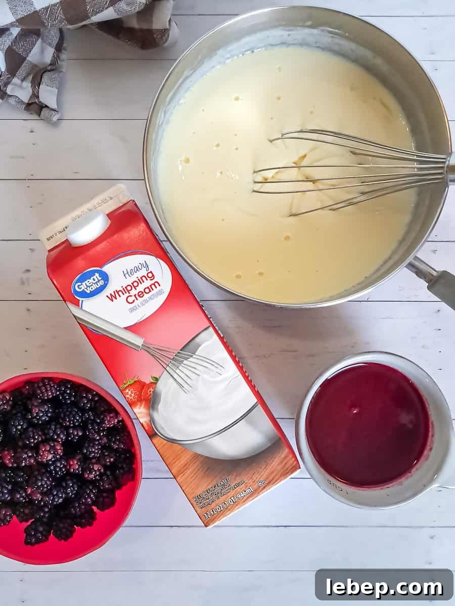 Creamy Amish Blackberry Ice Cream Recipe for Summer 5 custard in sauepan, berry sauce in a cup, heavy cream, and berries: ready to mix the ice cream.