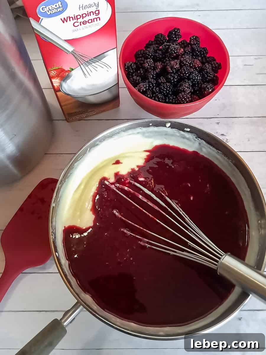 Creamy Amish Blackberry Ice Cream Recipe for Summer 6 mixing the berry sauce into the custard base.