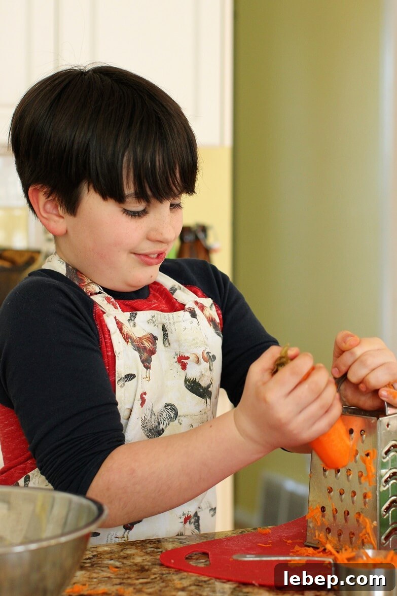 Make Sausage Patties at Home with Kids: Kid-Friendly Recipe and Tips 4 William grating a carrot