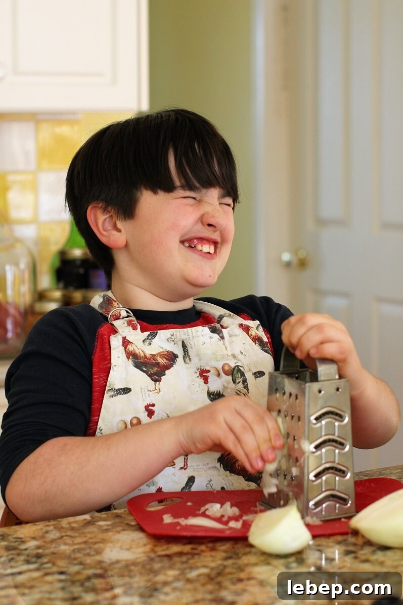 Make Sausage Patties at Home with Kids: Kid-Friendly Recipe and Tips 5 Yowee, William winces as he grates the onion
