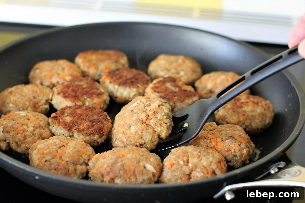 Make Sausage Patties at Home with Kids: Kid-Friendly Recipe and Tips 9 a skillet full of the frying homemade sausage patties