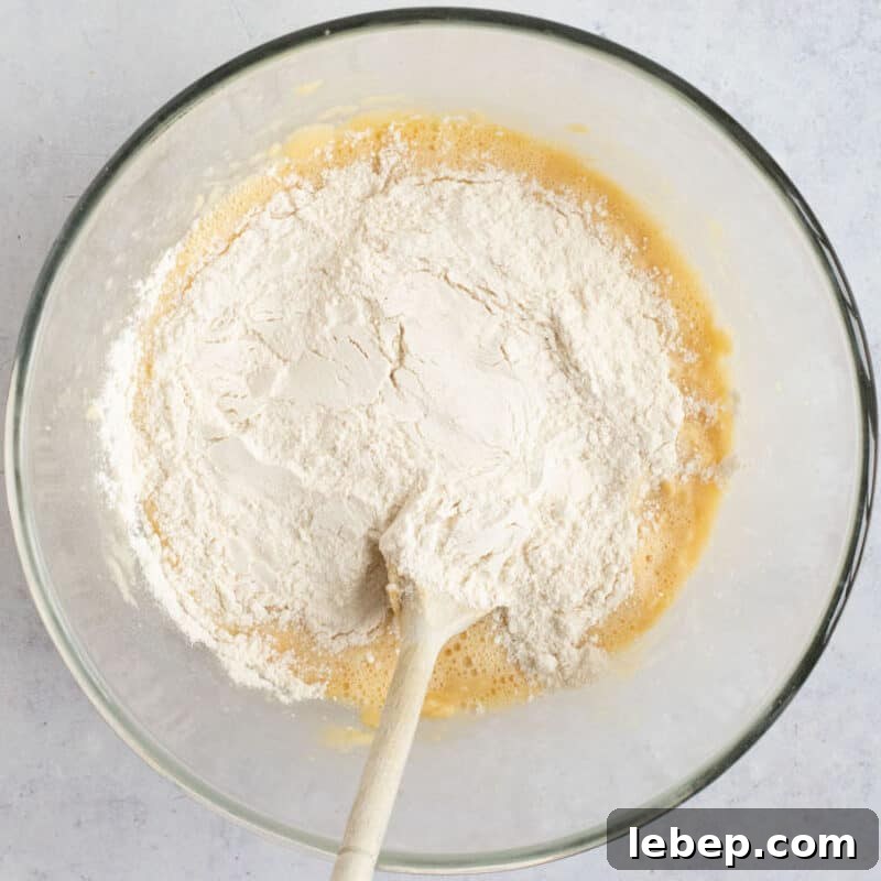 Air Fryer Banana Bread Recipe: Moist, Quick Loaf in 30 Minutes 6 Flour added to cake batter.