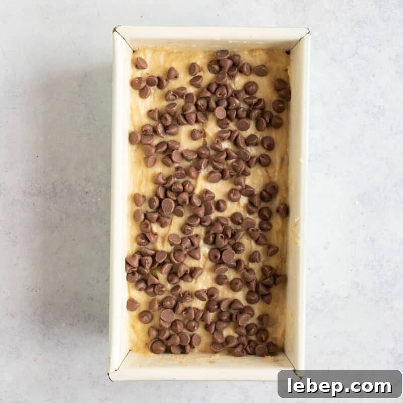 Air Fryer Banana Bread Recipe: Moist, Quick Loaf in 30 Minutes 8 Banana bread in loaf tin.