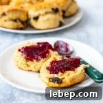 fruit scone on a plate with jam