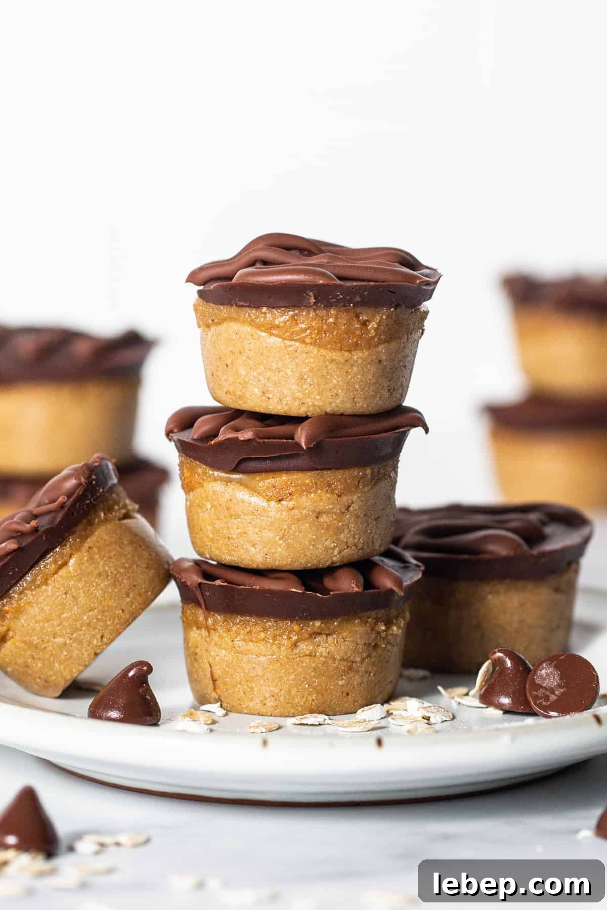 Peanut Butter Twix Cups Recipe — Homemade Candy Bars in Minutes 7 A stack of chocolate peanut butter cups on a plate.