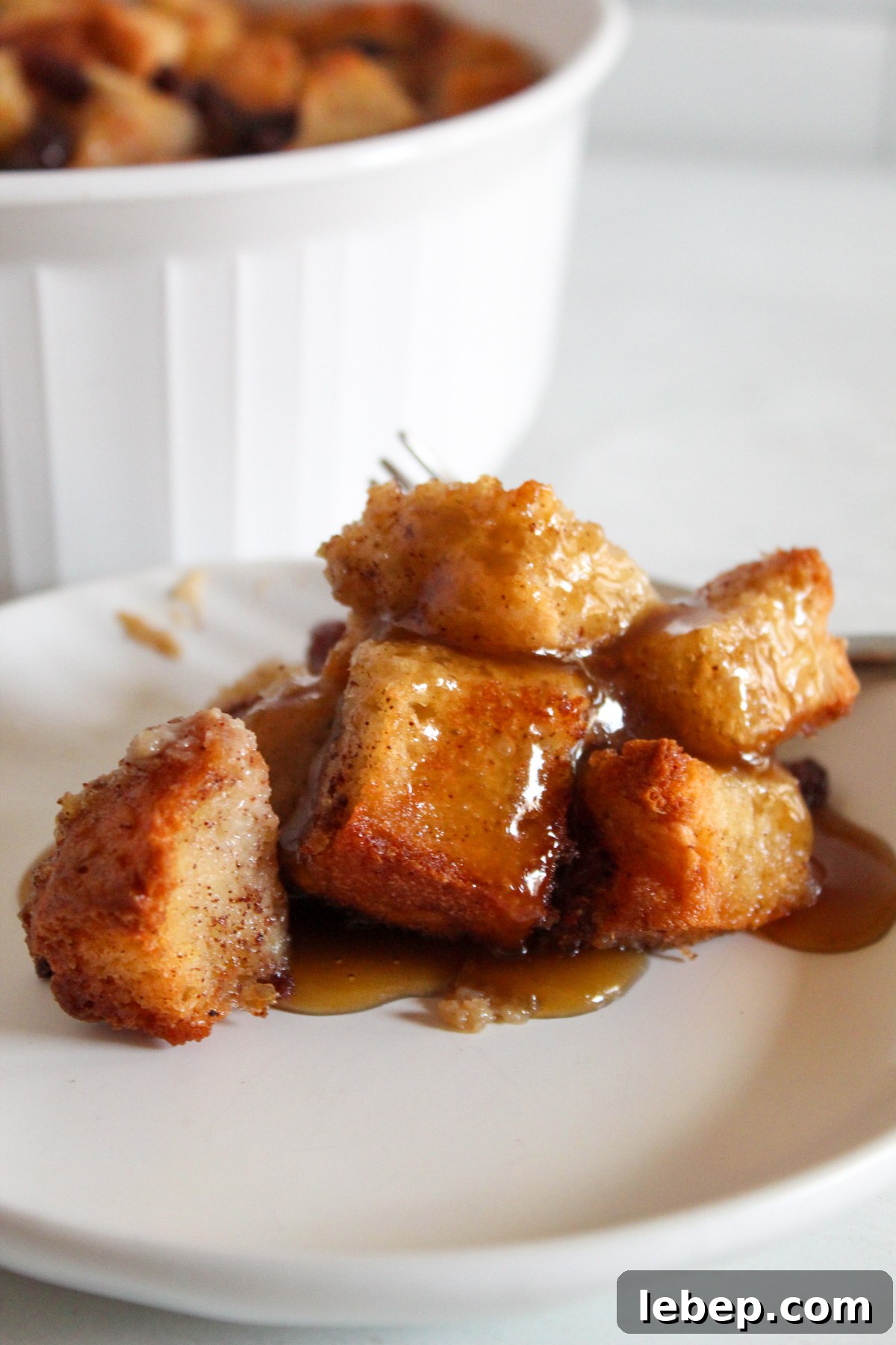 serving of gluten free bread pudding on a plate.
